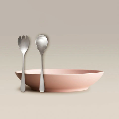 All Is Served Set shown with a pale pink bowl and silver forks and spoons leaning against it