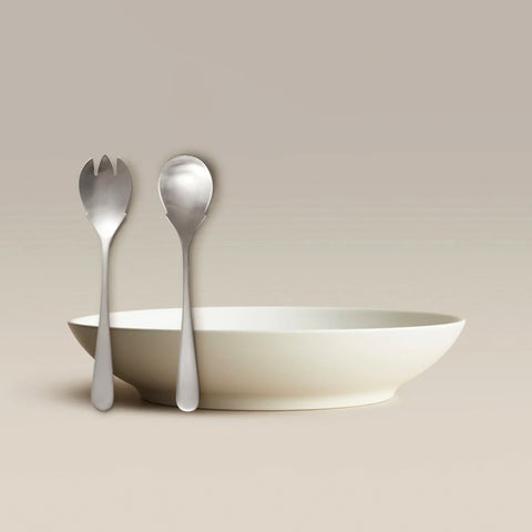 All Is Served Set features a white bowl with two silver utensils standing against a neutral backdrop