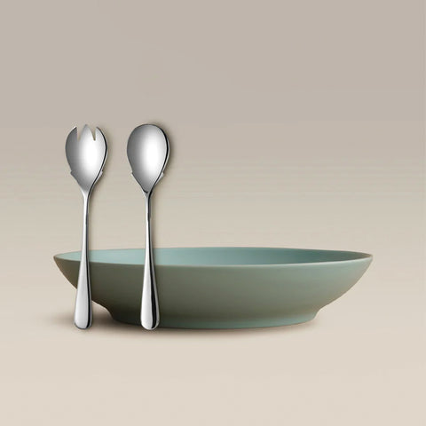 All Is Served Set with two silver utensils resting against a pale green shallow bowl