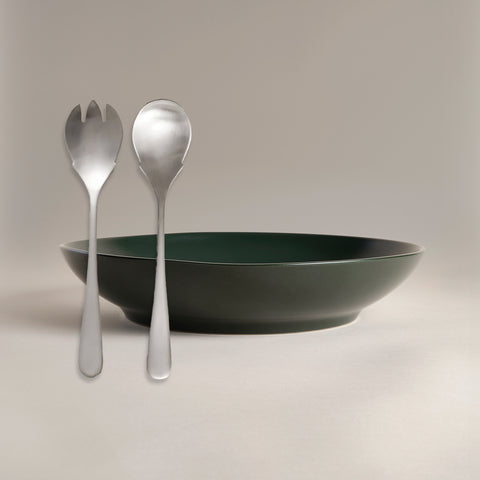 All Is Served Set two silver utensils lean against a dark green bowl.